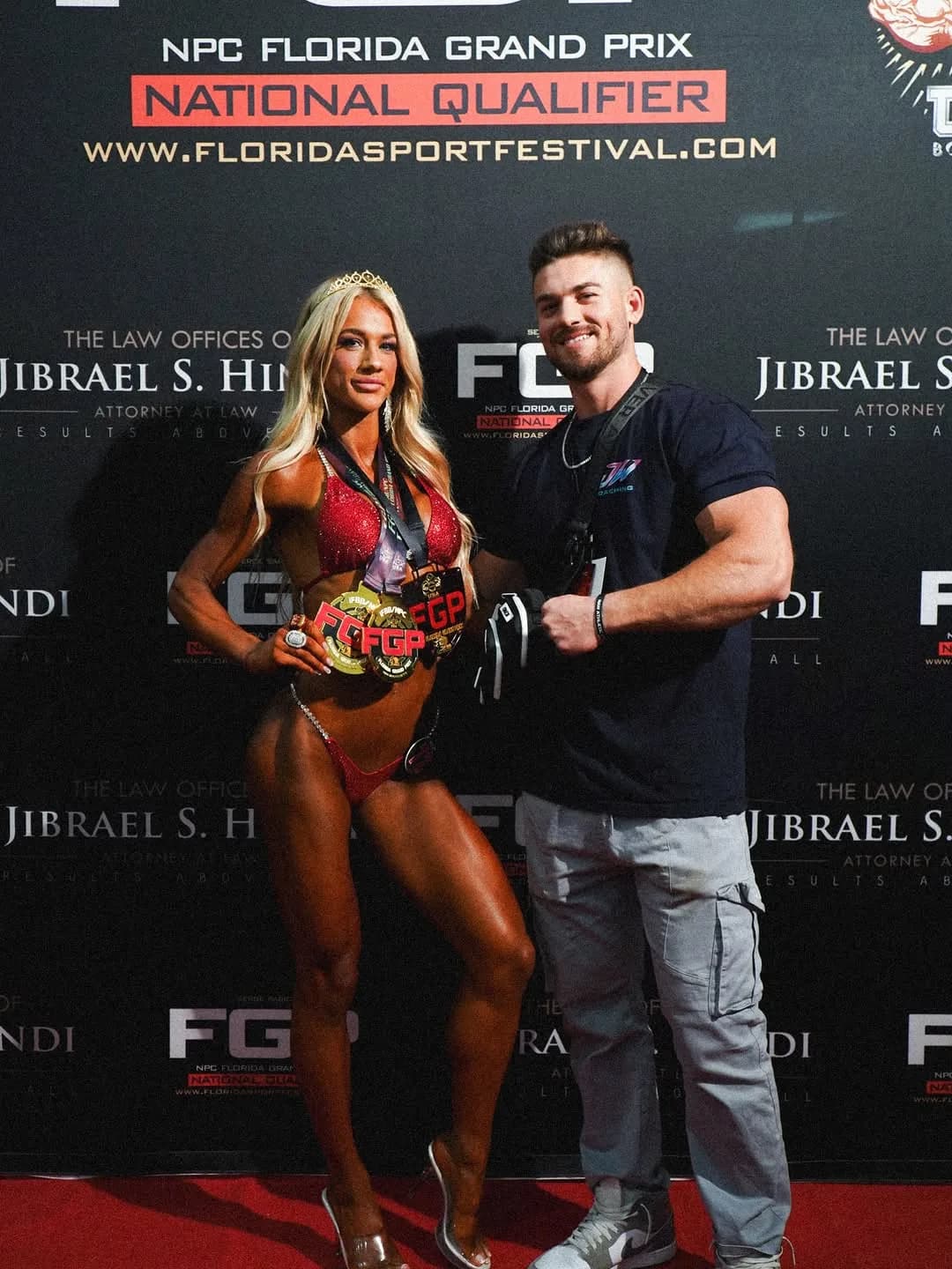 Jared with a client and her NPC Florida Grand Prix champion belt